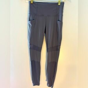 Athleta women’s XS legging.  Sheer panel on legs, 2 side pockets.